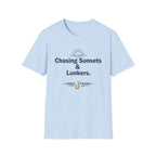 Light blue Comfort Colors unisex t-shirt with "Chasing Sunsets & Lunkers." and "REEL FSHN" fishing hook graphic.