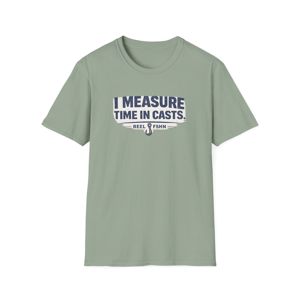 Sage green Comfort Colors t-shirt with "I MEASURE TIME IN CASTS" graphic and fishing hook logo.