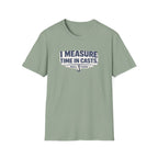 Sage green Comfort Colors t-shirt with "I MEASURE TIME IN CASTS" graphic and fishing hook logo.