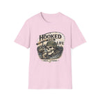 Light pink Comfort Colors unisex t-shirt with "Hooked For Life" text and a fishing skull graphic.