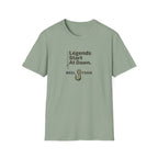 Unisex Comfort Colors sage green t-shirt with "Legends Start At Dawn" text and a fishing hook graphic.