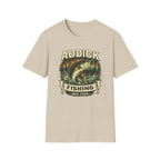 Unisex Comfort Colors sand t-shirt with "ADDICK FISHING REEL FSHN" graphic featuring a jumping bass.