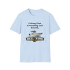 Light blue Comfort Colors cotton t-shirt with "Fishing First. Everything Else Second." text and a fishing boat graphic above "REEL FSHN" with a hook.