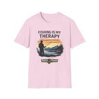 Pink Comfort Colors unisex t-shirt with "Fishing Is My Therapy" graphic of a fisherman at sunset.