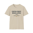 Comfort Colors sand t-shirt with "Catch First. Brag Later." text and a fish graphic above "REEL FSHN".