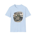 Light blue Comfort Colors unisex t-shirt with "Hooked For Life" text, a fishing skull, and a reel design.