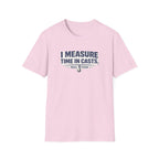 Pink Comfort Colors unisex t-shirt with "I Measure Time In Casts" and "REEL FSHN" fishing graphic.
