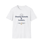 White Comfort Colors unisex t-shirt with "Chasing Sunsets & Lunkers" text and a fishing hook graphic.