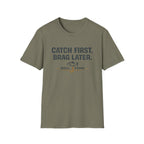 Unisex olive green Comfort Colors t-shirt with "CATCH FIRST. BRAG LATER." and fishing hook graphic.