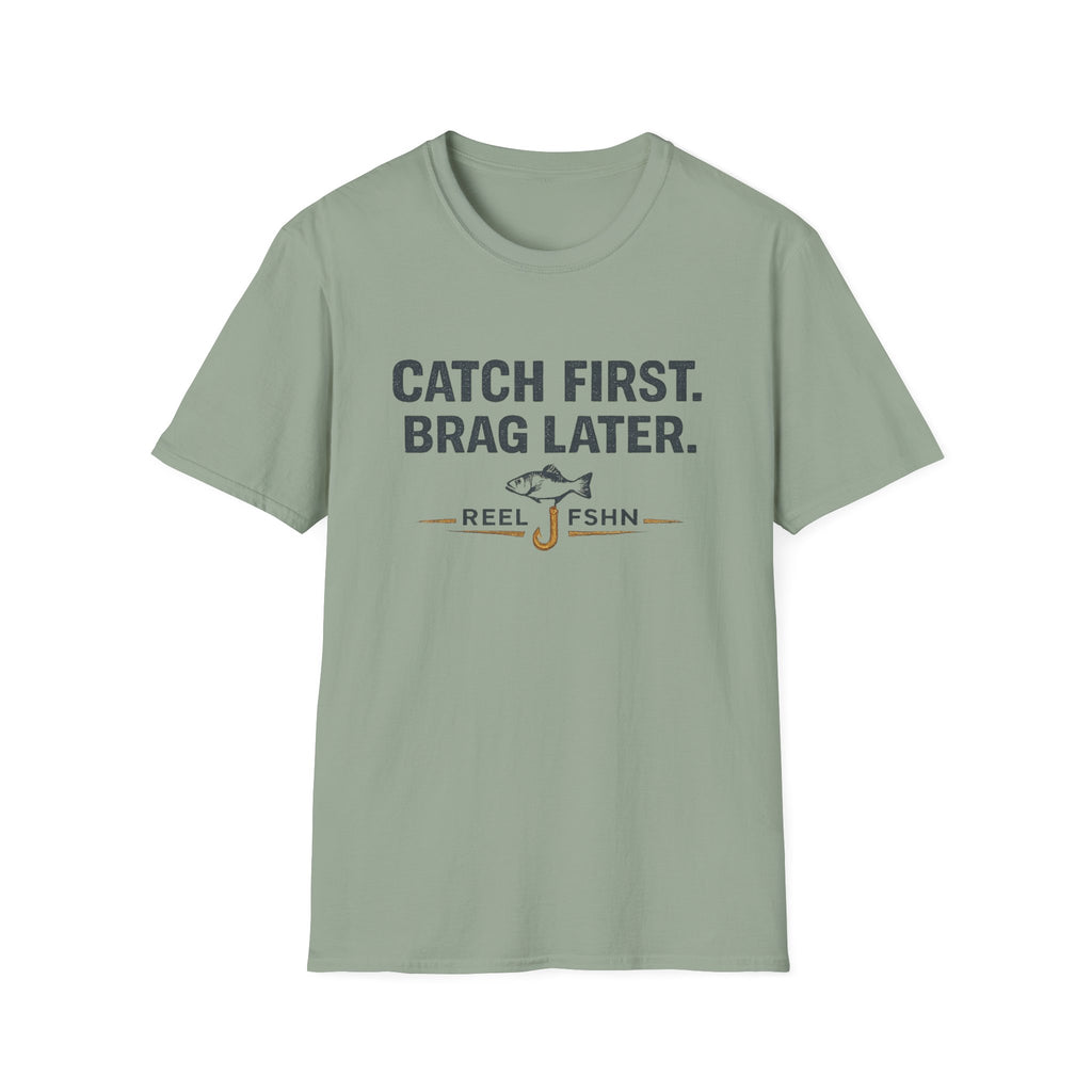 Comfort Colors sage green unisex t-shirt with "Catch First. Brag Later." text and fishing hook/fish graphic.
