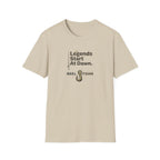 Unisex Comfort Colors "Legends Start At Dawn" t-shirt in sand, featuring a fishing hook graphic.