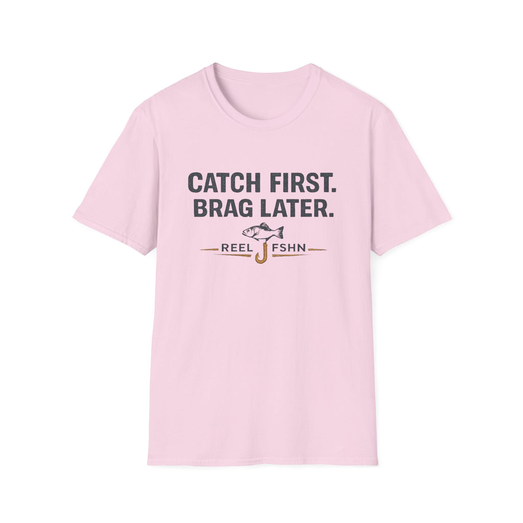 Light pink Comfort Colors unisex t-shirt with "CATCH FIRST. BRAG LATER." text and fishing hook graphic.