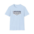 Light blue Comfort Colors unisex t-shirt with "I MEASURE TIME IN CASTS" and fishing hook graphic.