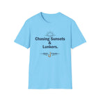 Light blue Comfort Colors unisex tee with "Chasing Sunsets & Lunkers" text and a fishing hook graphic.