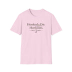 Pink Comfort Colors unisex t-shirt with "Hooked On Horizons. REEL ESHN" text and fishing hook graphic.