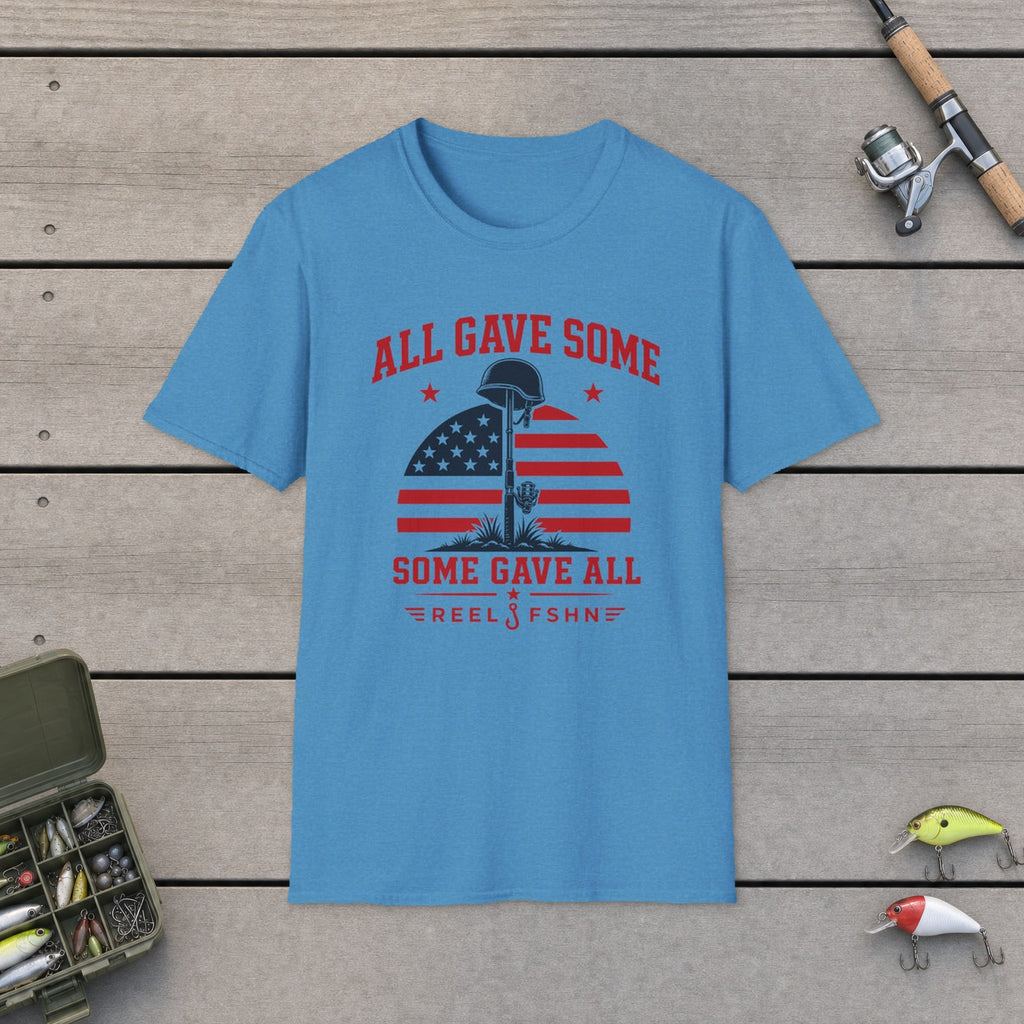 All Gave Some Some Gave All T-Shirt flat-laid on wooden dock boards beside a fishing rod and tackle box