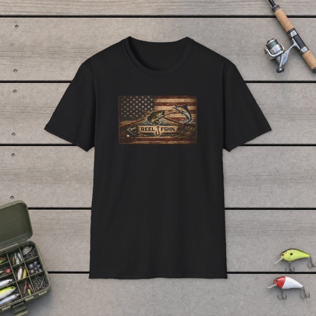 American Flag With Bass and Marlin T-Shirt flat-laid on wooden dock boards beside a fishing rod and tackle box