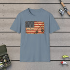 American Flag With Two Rods T-Shirt on a wooden dock with fishing rod, reel, tackle box and lures