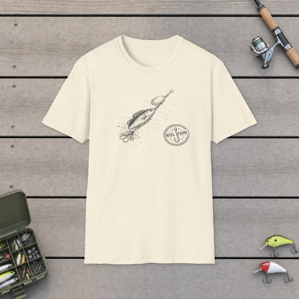 Anatomy Of A Lure T-Shirt flat-laid on wooden dock boards beside a fishing rod and tackle box