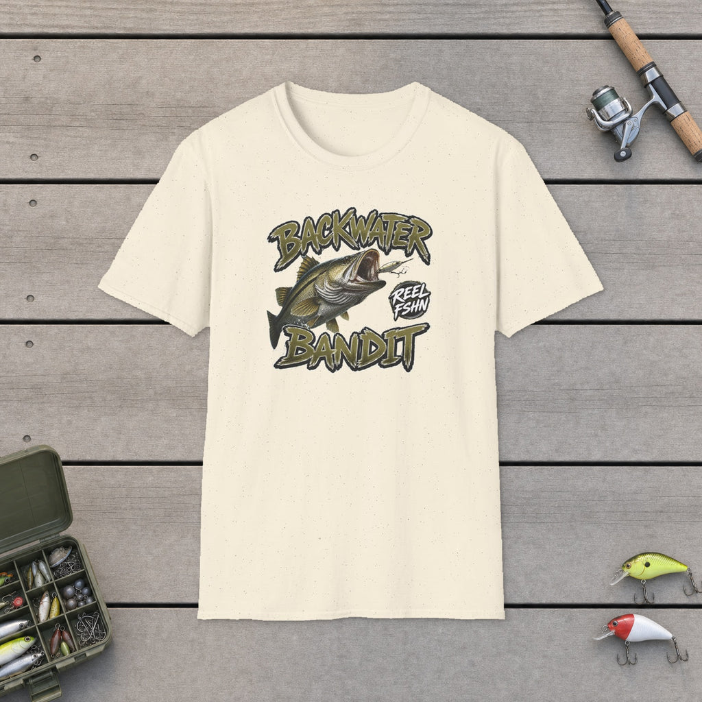 Backwater Bandit T-Shirt flat-laid on wooden dock boards beside a fishing rod and tackle box