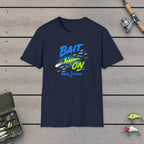 Bait On (single lure)  T-Shirt on a wooden dock with fishing rod, reel, tackle box and lures