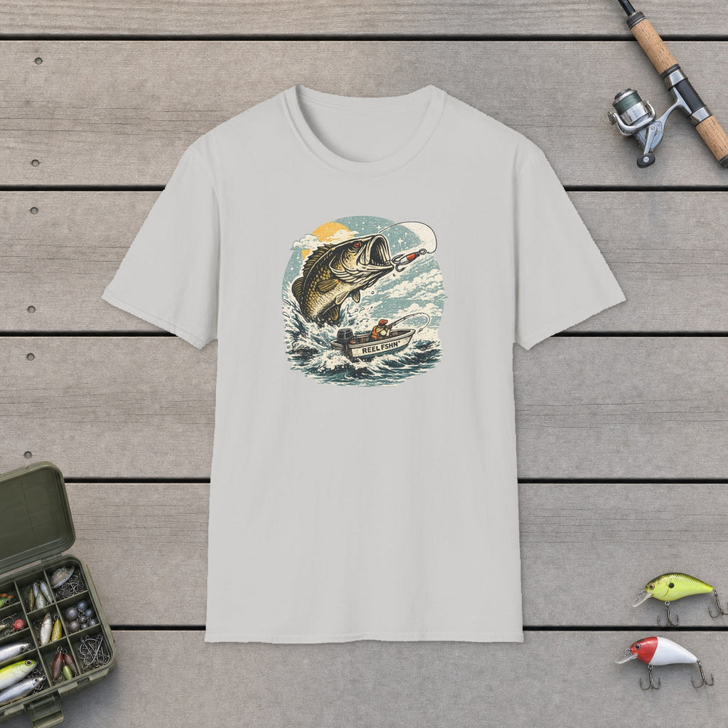 Bass Graphic with Boat T-Shirt flat-laid on wooden dock boards beside a fishing rod and tackle box
