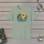 Bass with REEL FSHN Logo T-Shirt on a wooden dock with fishing rod, reel, tackle box and lures