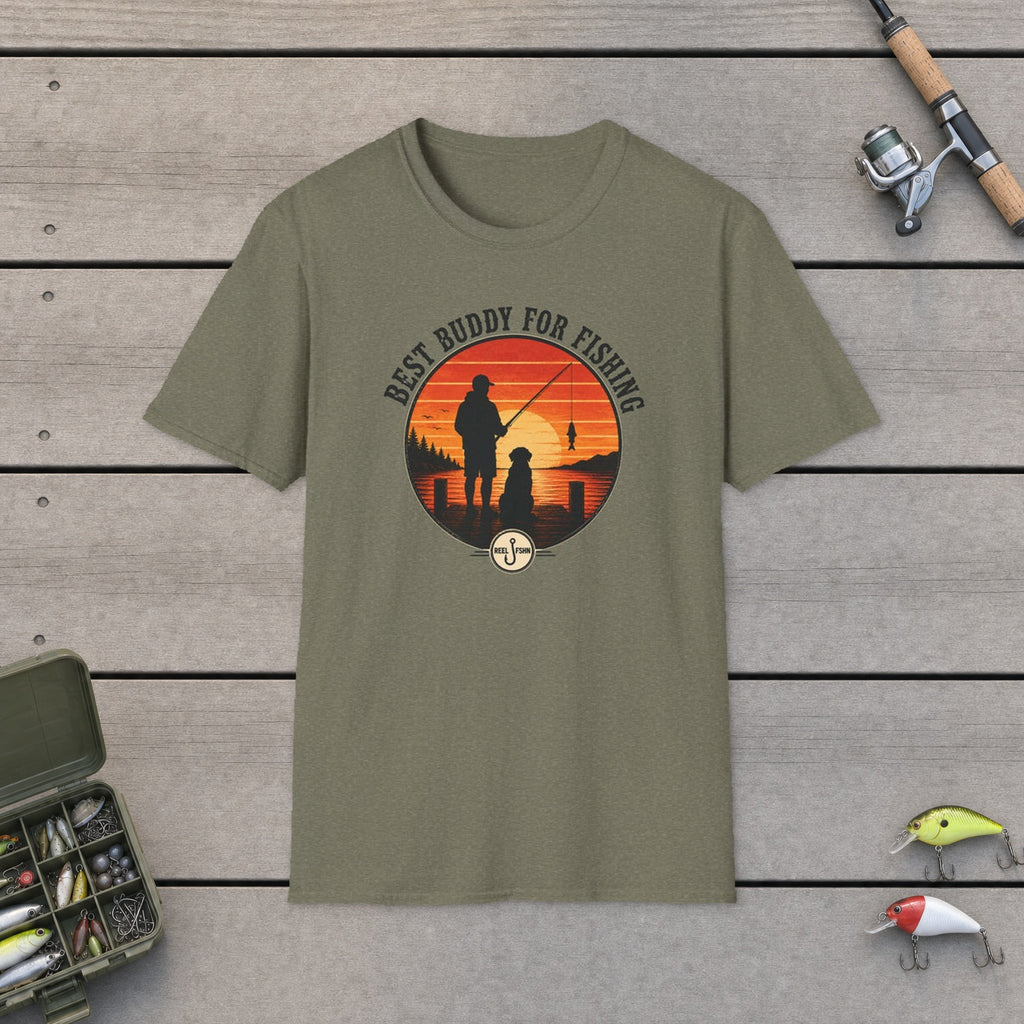 Best Buddy For Fishing T-Shirt flat-laid on wooden dock boards beside a fishing rod and tackle box