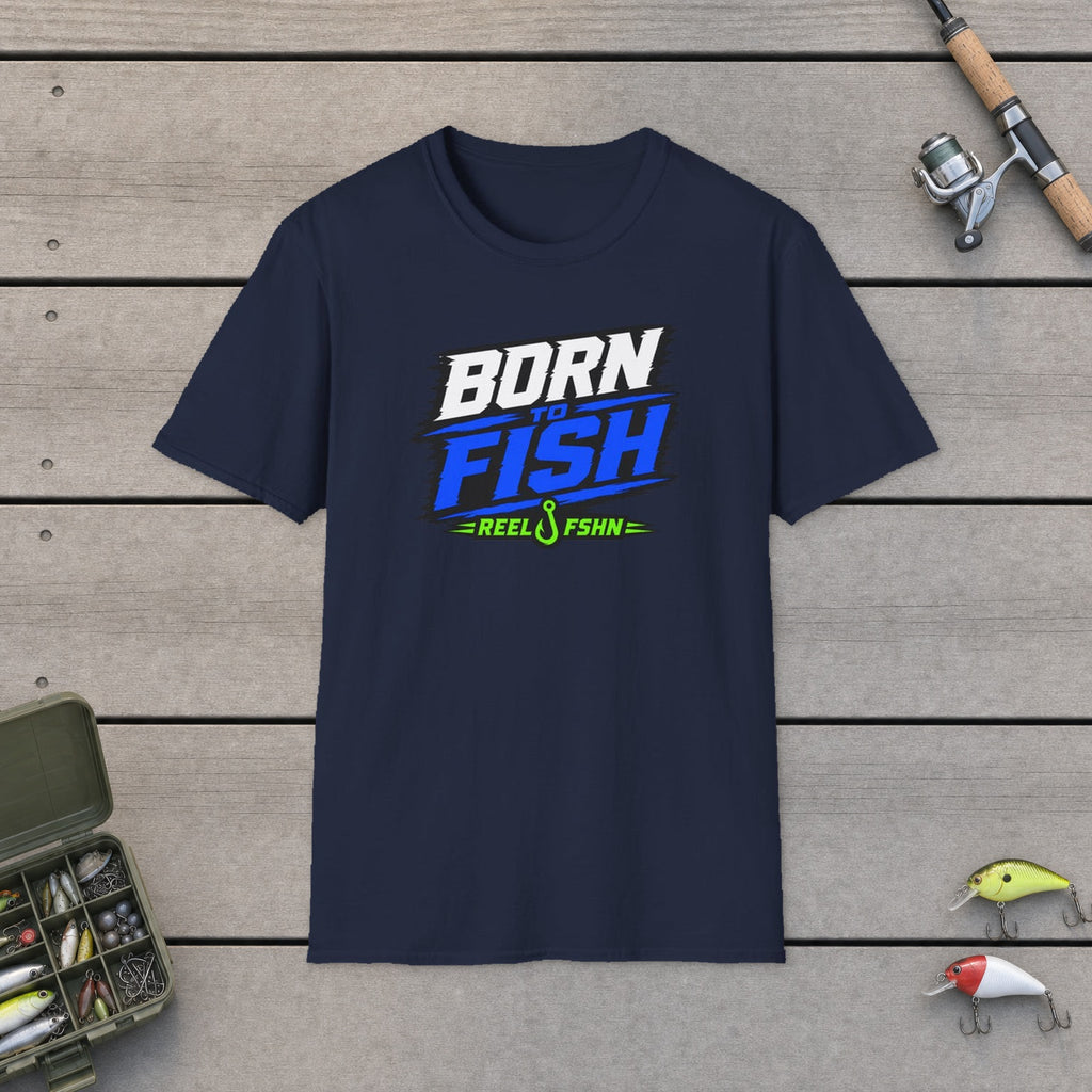Born To Fish T-Shirt flat-laid on wooden dock boards beside a fishing rod and tackle box