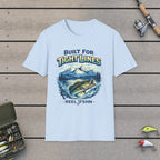 "Built for Tight Lines" T-Shirt on a wooden dock with fishing rod, reel, tackle box and lures