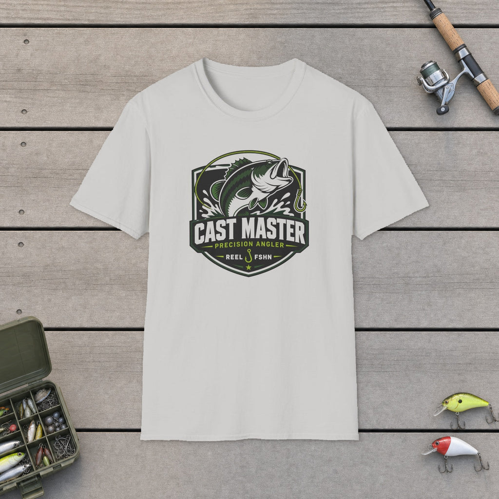 Cast Master T-Shirt flat-laid on wooden dock boards beside a fishing rod and tackle box