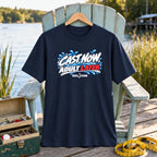 Cast Now, Adult Later REEL FSHN t-shirt, navy, hanging on a seafoam chair by the lake