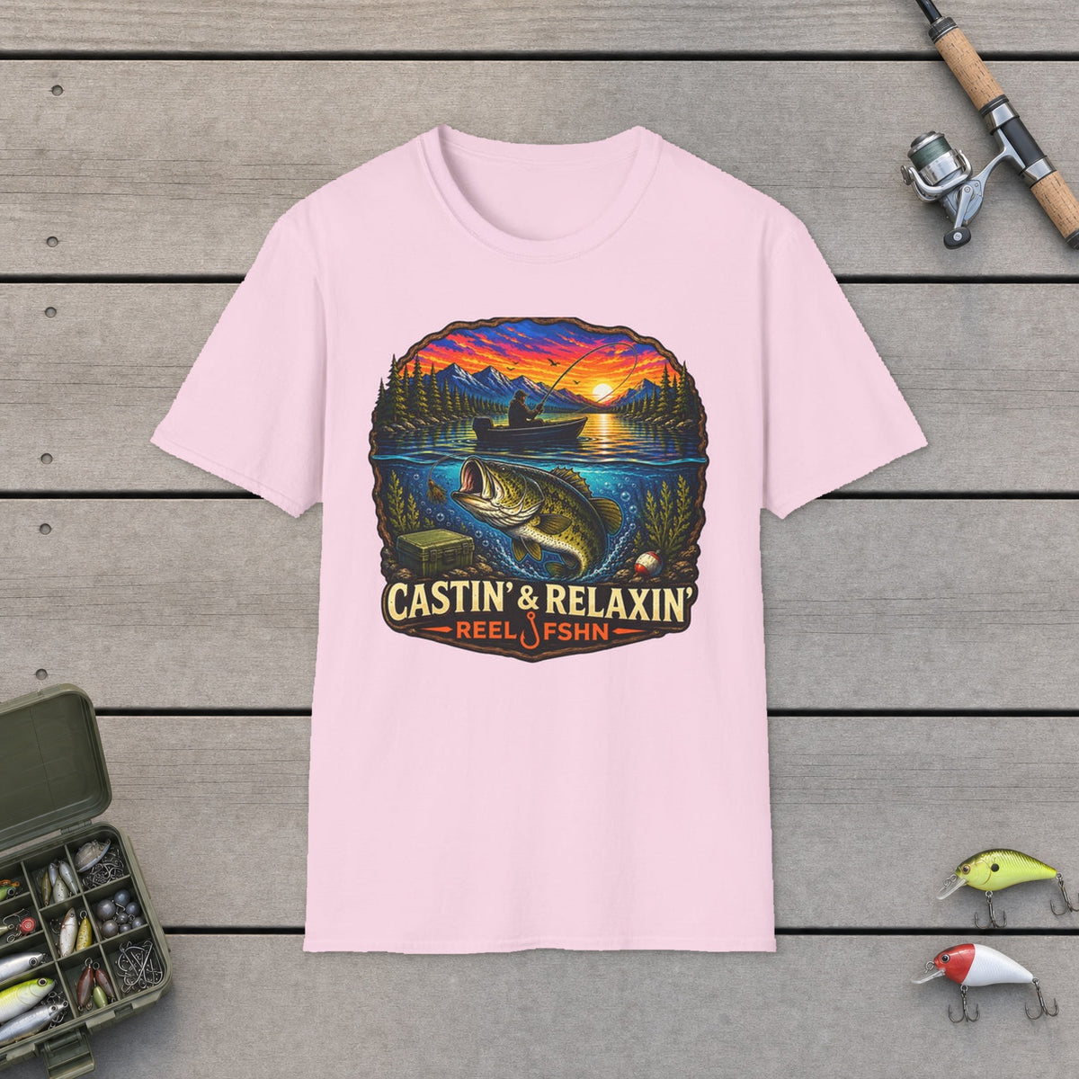 Castin & Relaxin T-Shirt on a wooden dock with fishing rod, reel, tackle box and lures