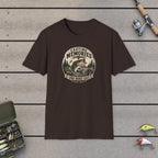 Casting Legends T-Shirt on a wooden dock with fishing rod, reel, tackle box and lures