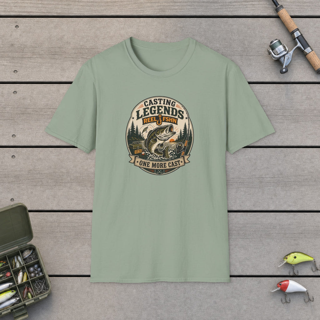 Casting Legends T-Shirt flat-laid on wooden dock boards beside a fishing rod and tackle box