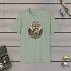 Casting Legends T-Shirt on a wooden dock with fishing rod, reel, tackle box and lures