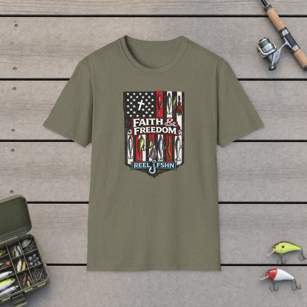 Faith & Freedom! T-Shirt flat-laid on wooden dock boards beside a fishing rod and tackle box