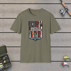Faith & Freedom! T-Shirt on a wooden dock with fishing rod, reel, tackle box and lures