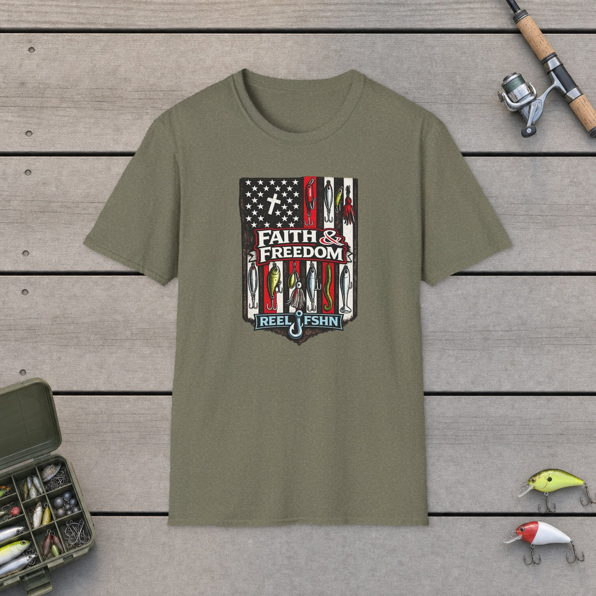 Faith & Freedom! T-Shirt on a wooden dock with fishing rod, reel, tackle box and lures
