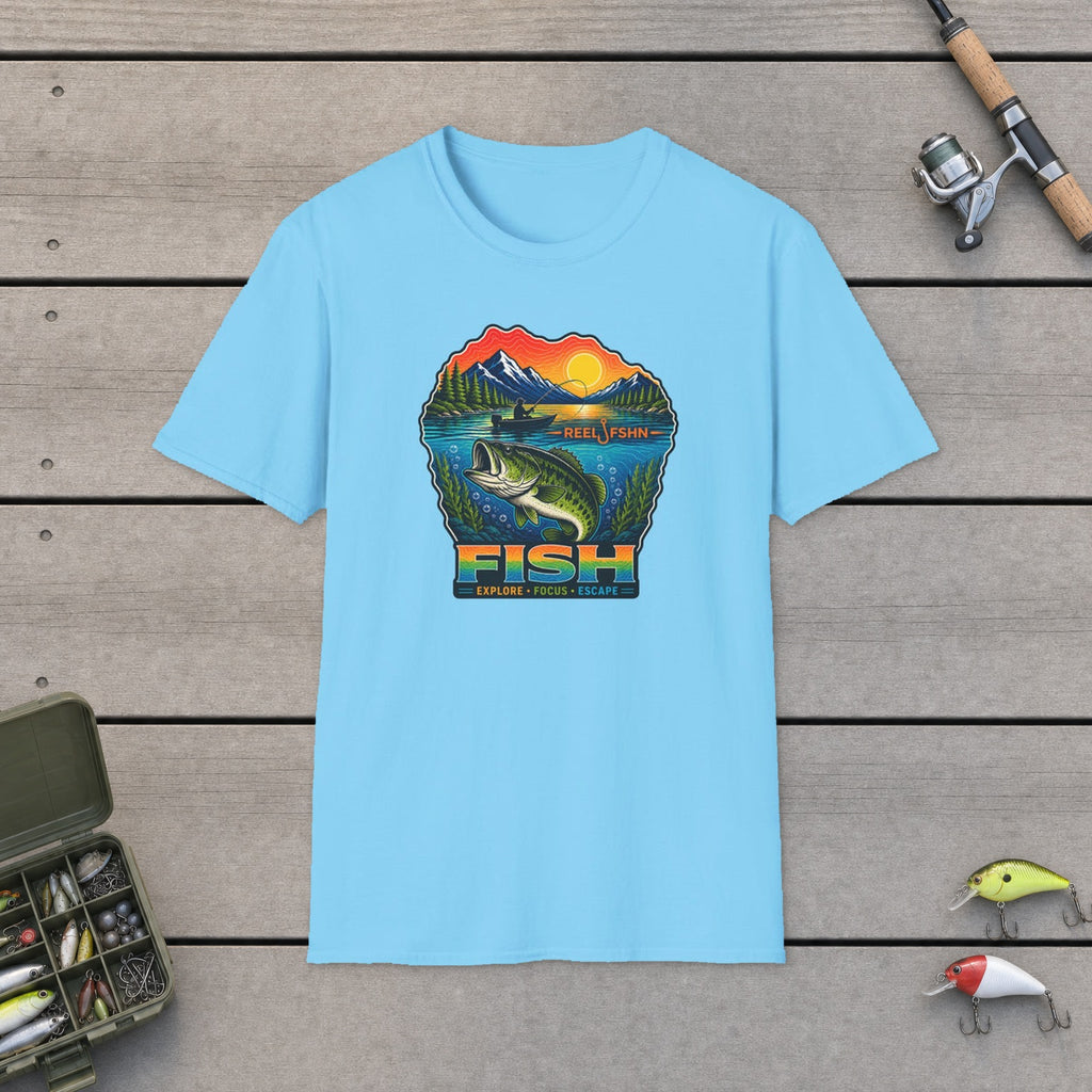 Fish Explore Focus Escape  T-Shirt flat-laid on wooden dock boards beside a fishing rod and tackle box