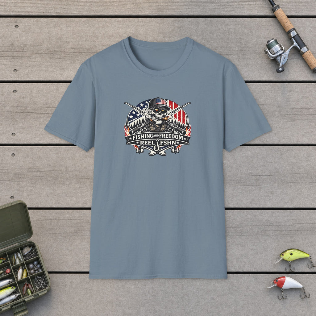 Fishing & Freedom T-Shirt flat-laid on wooden dock boards beside a fishing rod and tackle box