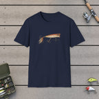 Fishing Lure T-Shirt on a wooden dock with fishing rod, reel, tackle box and lures
