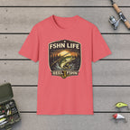 FSHN Life T-Shirt on a wooden dock with fishing rod, reel, tackle box and lures
