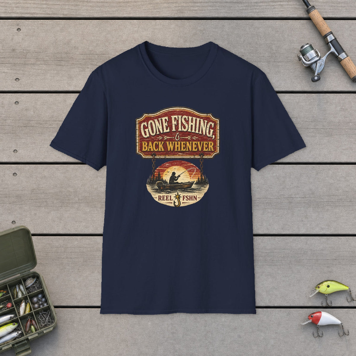 Gone Fishing Back Whenever T-Shirt on a wooden dock with fishing rod, reel, tackle box and lures