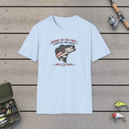 Home Of The Free Land Of The Bass T-Shirt on a wooden dock with fishing rod, reel, tackle box and lures