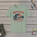 Honor The Fallen Remember Their Sacrifice T-Shirt on a wooden dock with fishing rod, reel, tackle box and lures