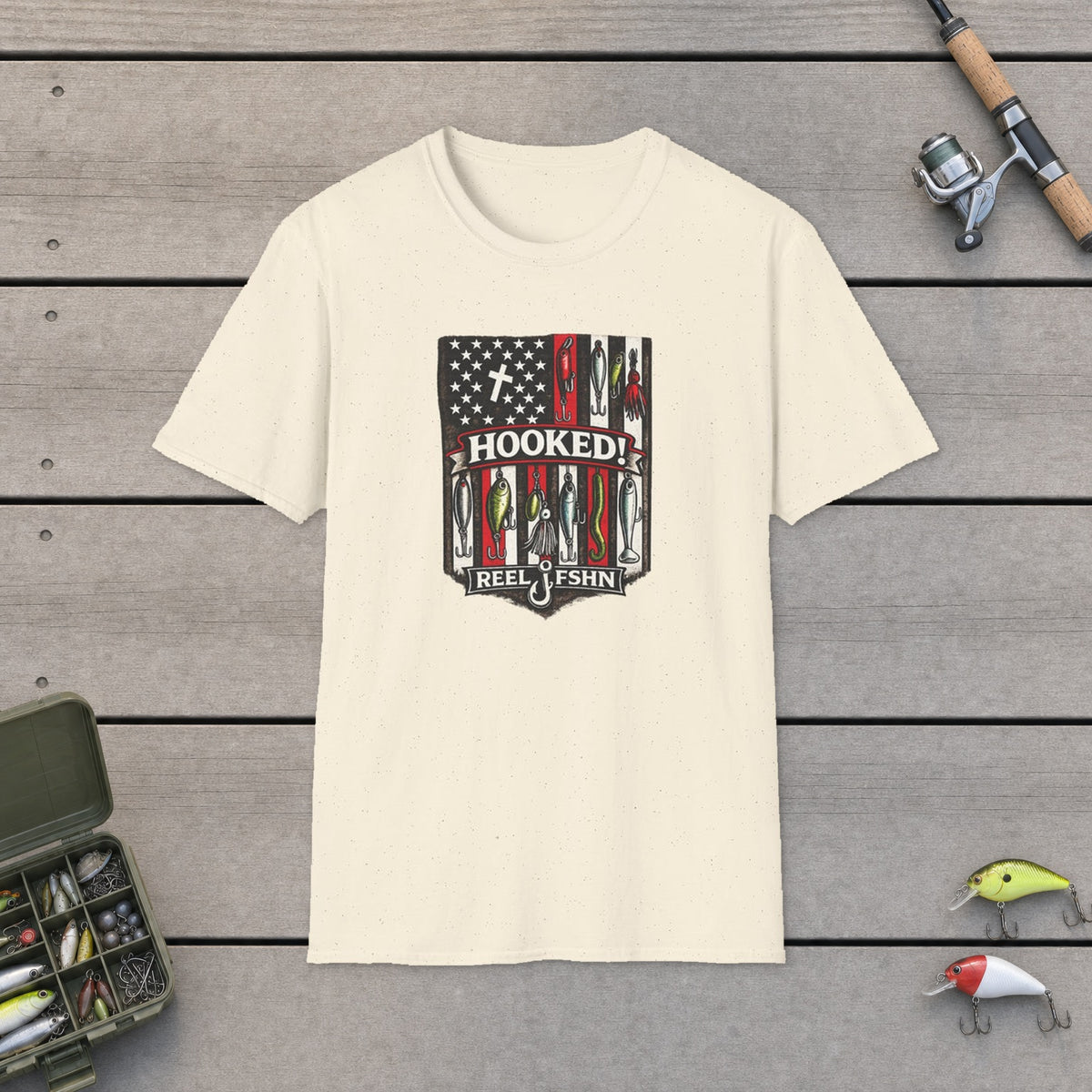 Hooked! T-Shirt on a wooden dock with fishing rod, reel, tackle box and lures