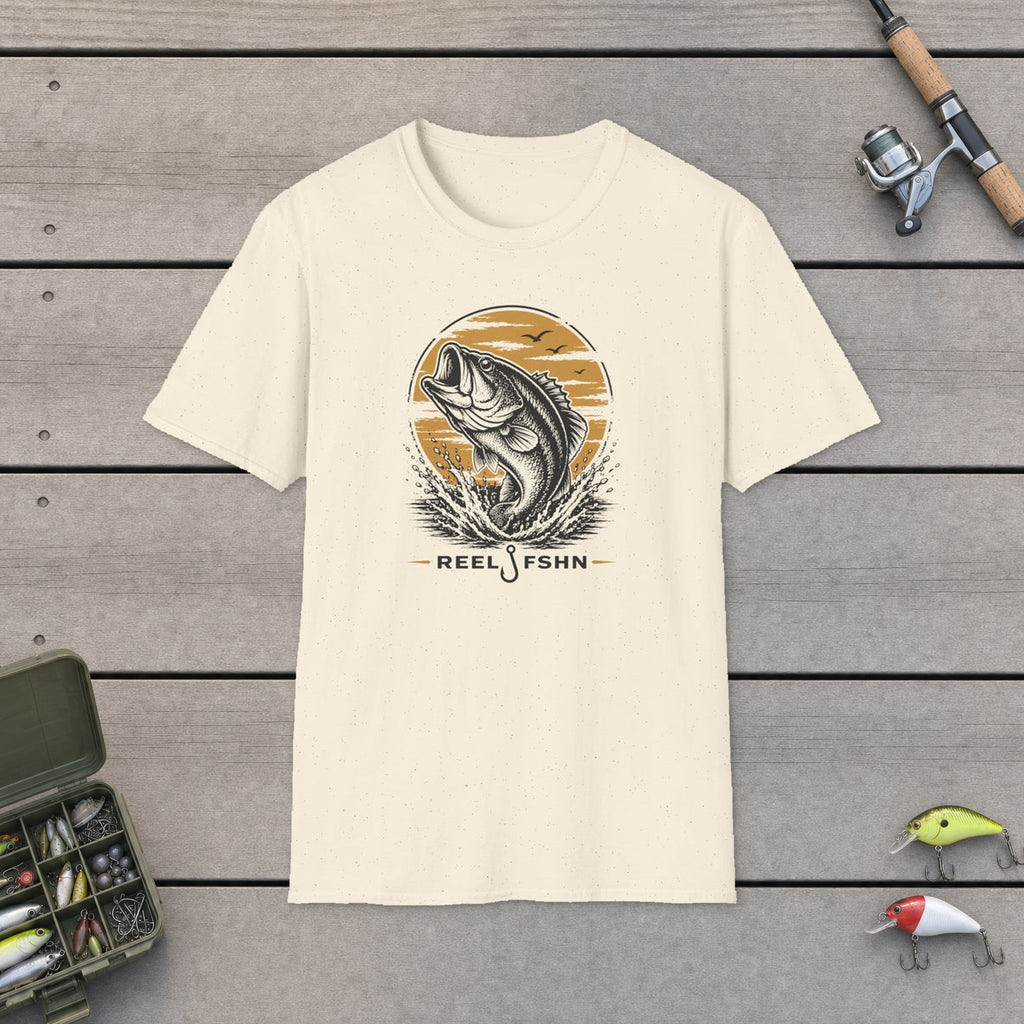 Jumping Bass T-Shirt flat-laid on wooden dock boards beside a fishing rod and tackle box