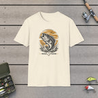 Jumping Bass T-Shirt on a wooden dock with fishing rod, reel, tackle box and lures
