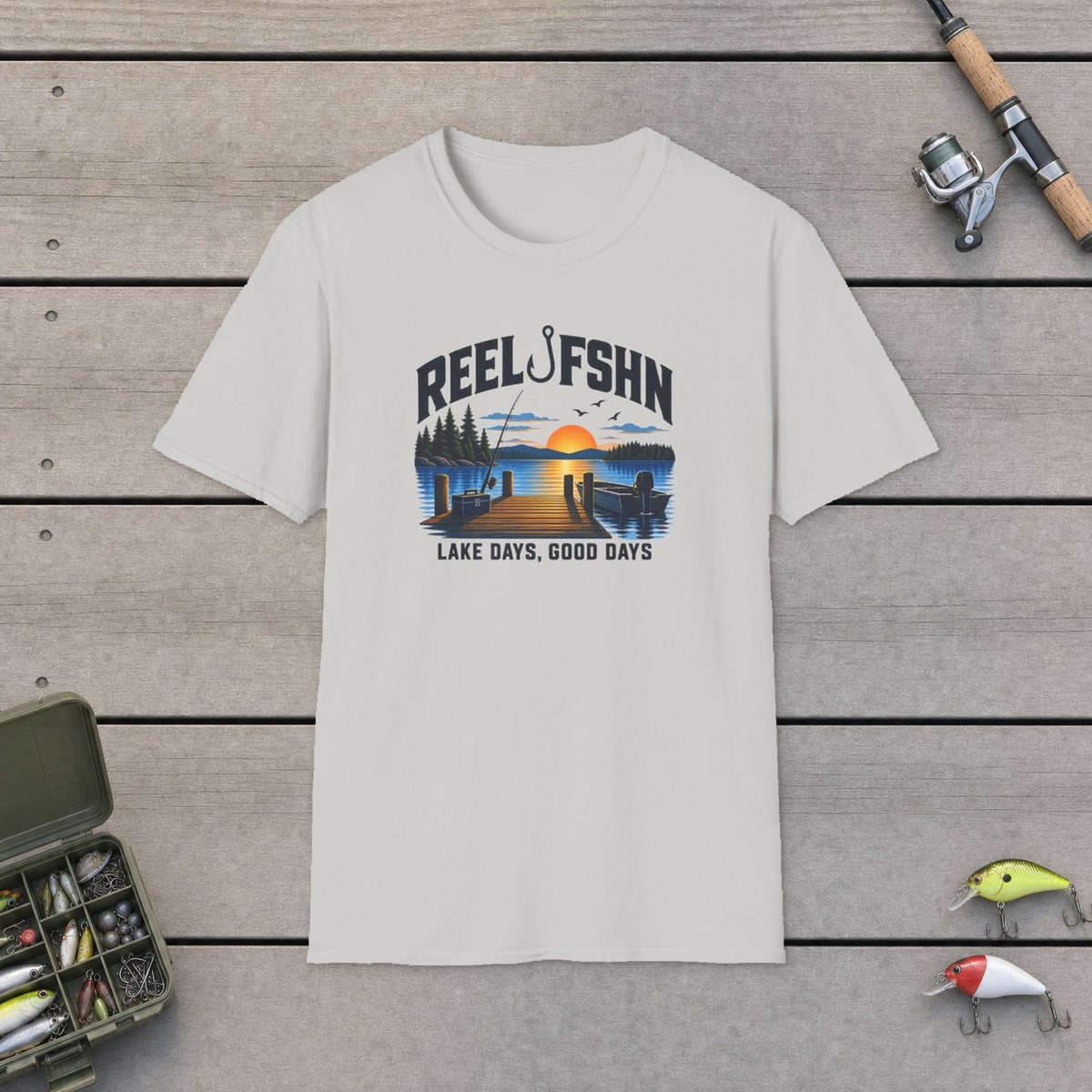 Lake Days Good Days T-Shirt on a wooden dock with fishing rod, reel, tackle box and lures